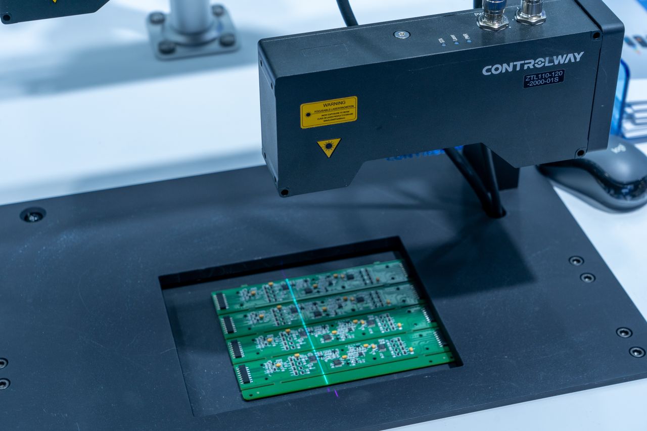 Portfolio Close-up of a PCB inspection machine in action, highlighting technology.